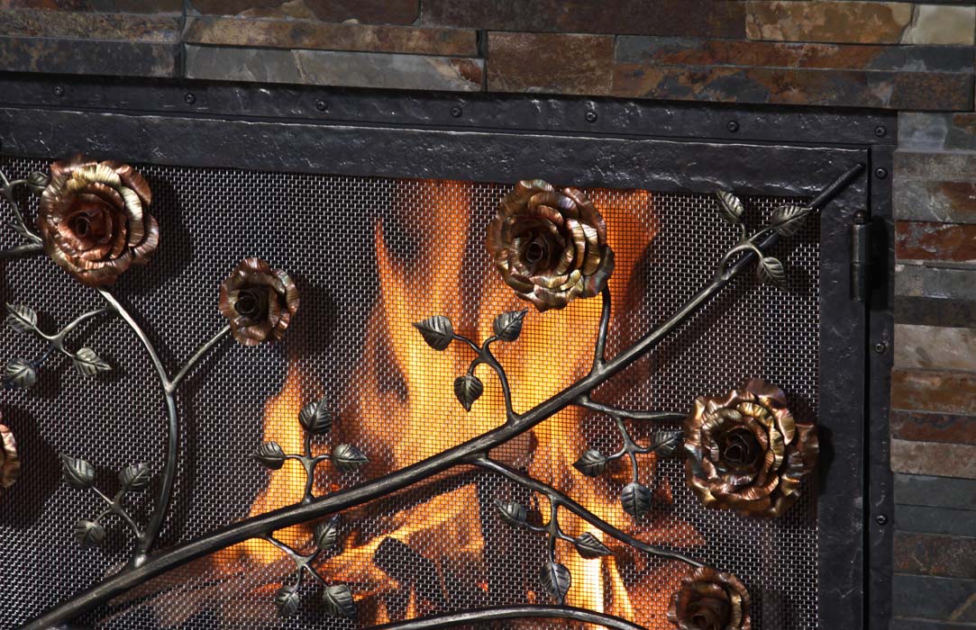 iron forged fireplace screen with metal rose flowers
